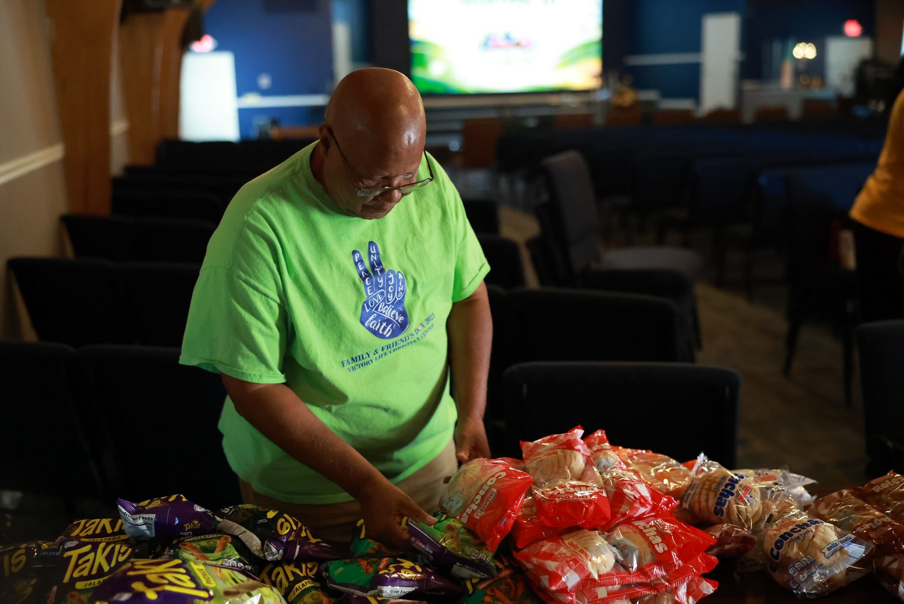 A Community Table volunteer preparing groceries for our neighbors