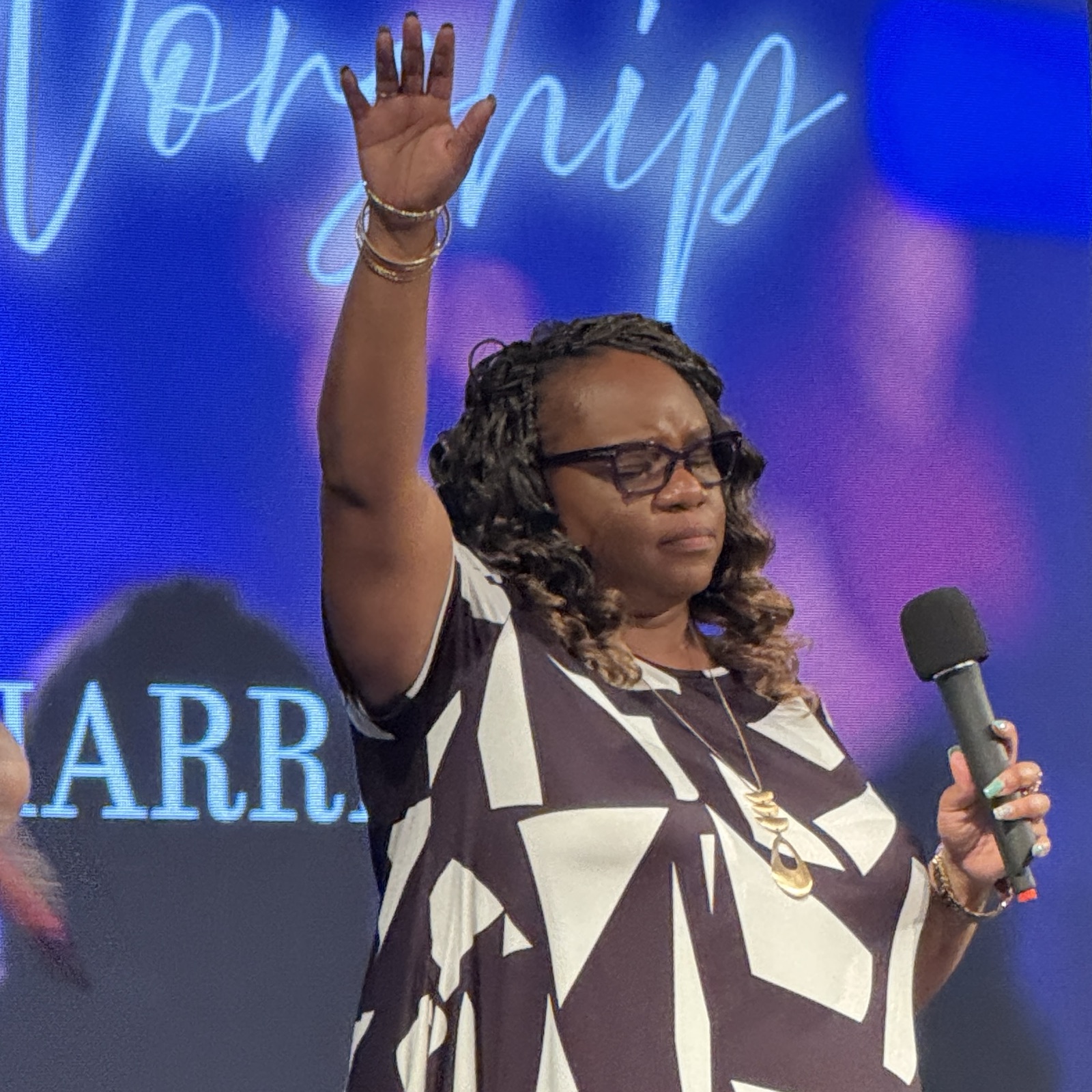 Lady Tamika White worshiping during a Victory Life service